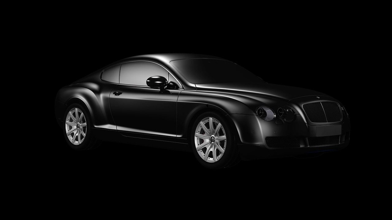 Dark luxury car in a studio