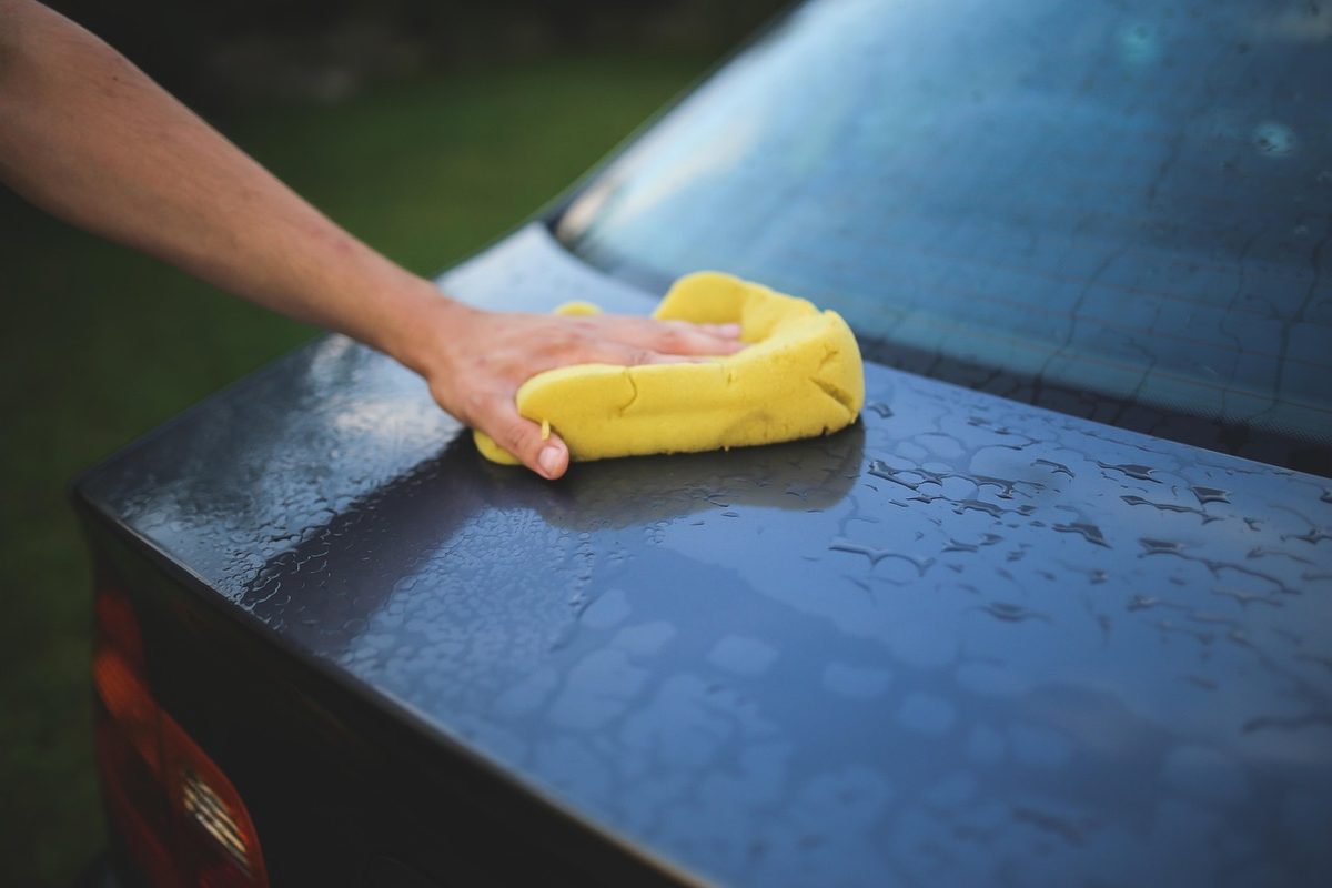 Hand polishing a dark clear coat panel